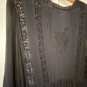 mid length crepe dress with crochet detail.